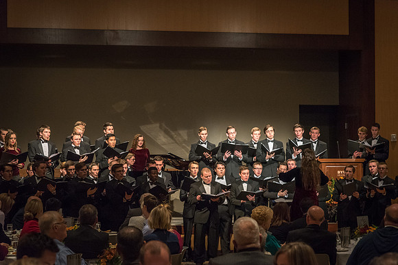 A choir performs a special musical number at the banquet.