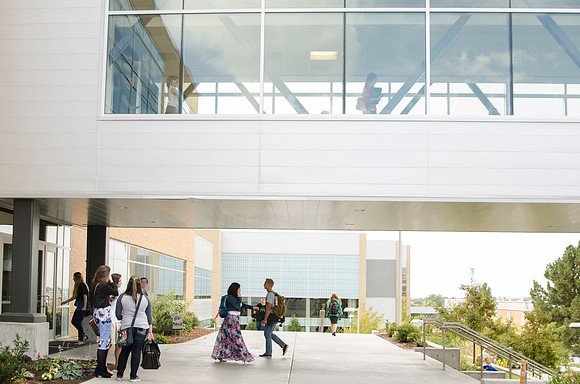 Students walking out on campus after devotional