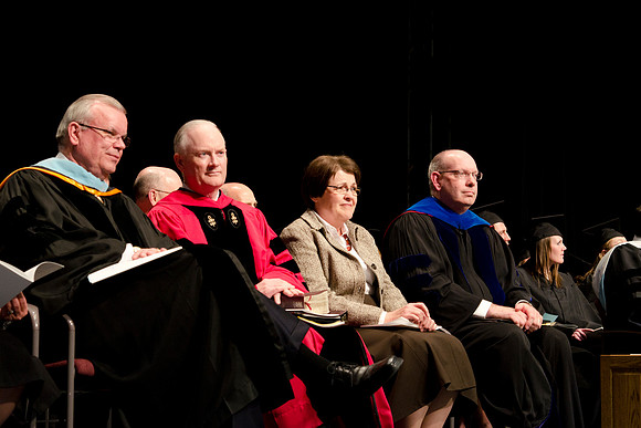 Elder Steven E. Snow, President and Sister Kim B. Clark and Kirk Gifford. College of Business and Communications convocation.