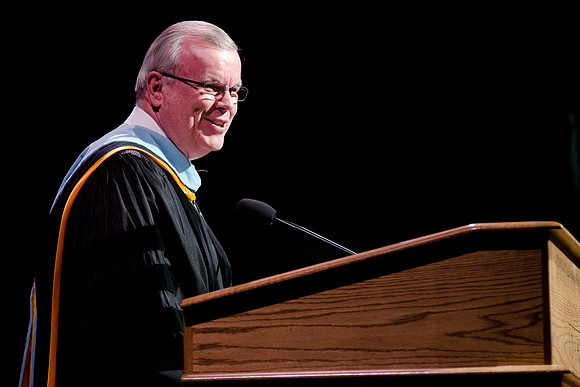 Elder Steven E. Snow speaking at the College of Business and Communications Convocation.