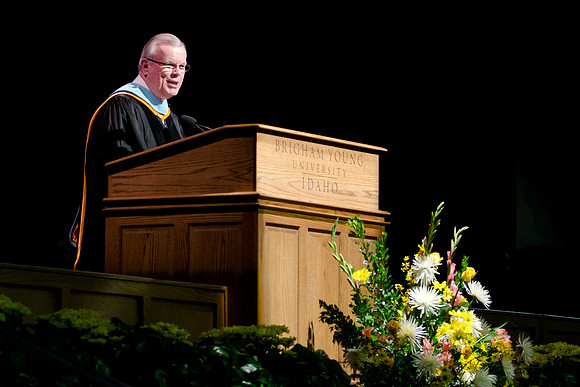 Elder Steven E. Snow speaking at the College of Business and Communications Convocation.