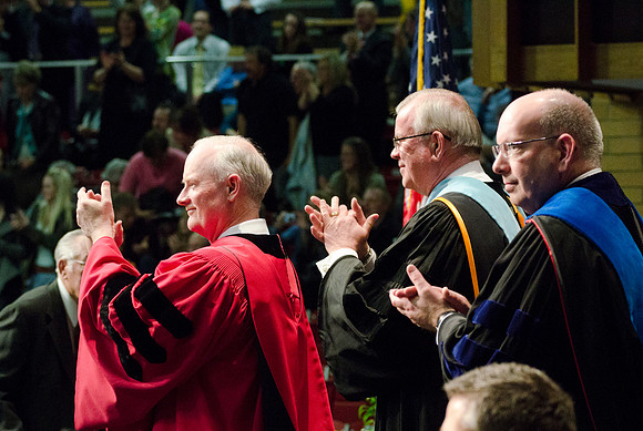 Pres Clark, Elder Steven E Snow and Associate Dean Kirk D Gifford contgratulate the graduates at the College of Business and Communications Convocation.