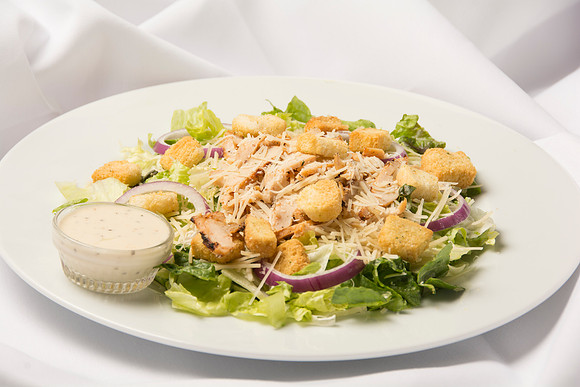 Romaine Lettuce with thinly sliced Red Onion, Fresh Parmesan Cheese, Grilled Chicken, and Croutons. Comes with Caesar Dressing.