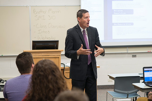 Business Management Faculty, Jeff Morrin, teaching an Advanced Financial Management class in Smith 440.