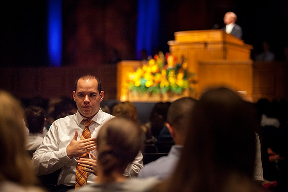 An ASL student signs during Brother Samuel Clay's devotional.