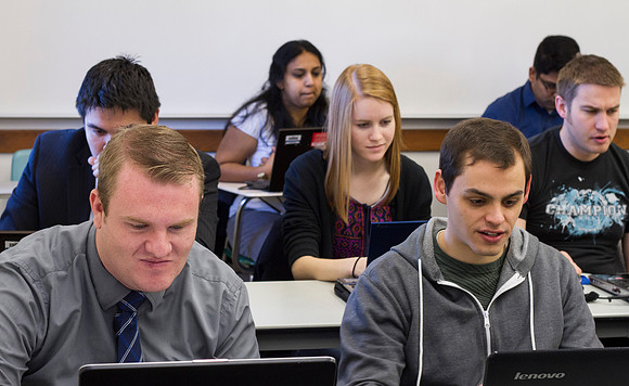 Students play The Root Beer Game in the Business Productions and Operations Management class taught by Brother Clark in the Romney Building.