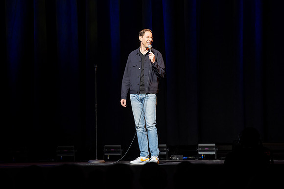 Ryan Hamilton performs a stand-up routine at the BYU-Idaho I-Center.
