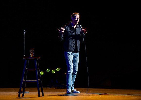 Ryan Hamilton performs a stand-up routine at the BYU-Idaho I-Center.