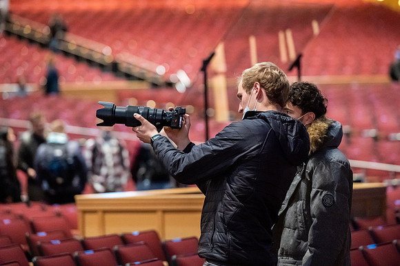 Photographer, James Turcotte after devotional in the BYU-Idaho Center.