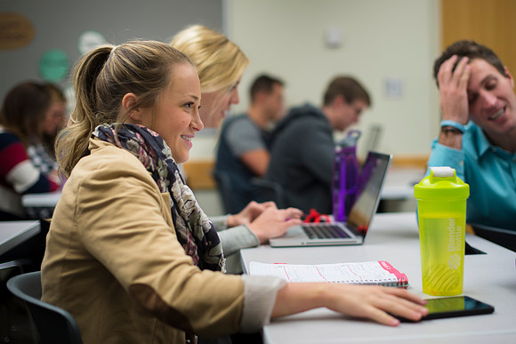 Visual Communications student, Katelyn Crompton, talks with group for future presentation.