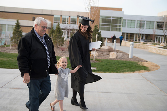 Graduates and their families on campus.