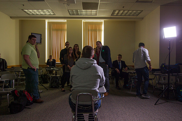 Brother Mawlam gives his students a hands on assignment during class on how to do a "lighted interview."
