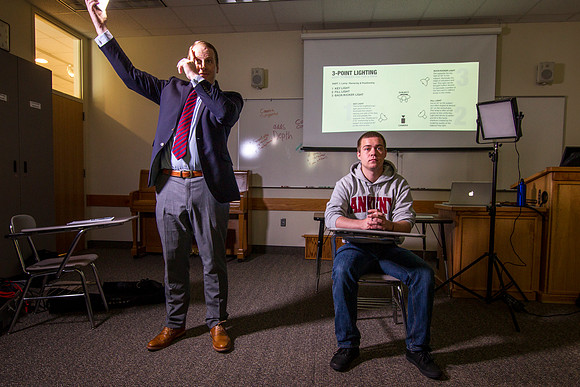 Brother Mawlam gives his students a hands on assignment during class on how to do a "lighted interview."