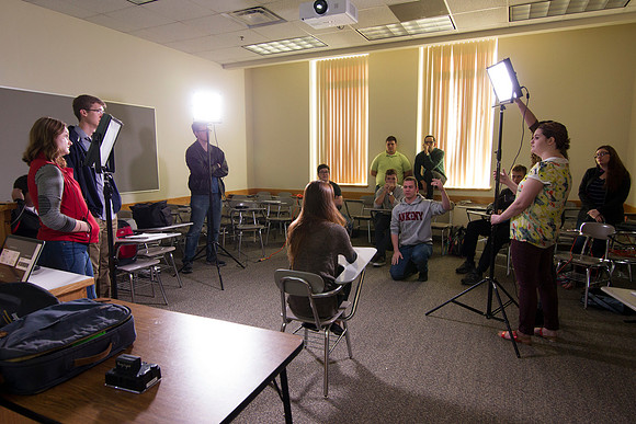 Brother Mawlam gives his students a hands on assignment during class on how to do a "lighted interview."