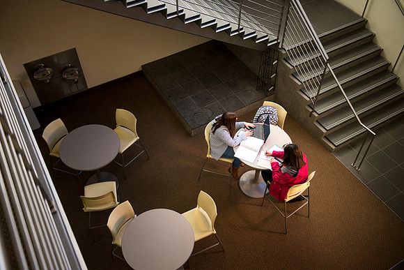 Mikala and Melissa study their music notes in the Snow Building.