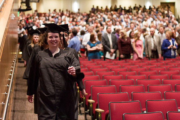 Graduates eagerly smile before the Commencement Cermony begins in the i-Center during the 2014 Winter Semester Graduation at BYU-Idaho.