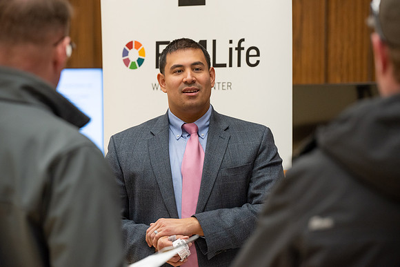 BYU-Idaho Faculty have booths promoting various mental wellness topics. Mix of students and employees mingle among booths.