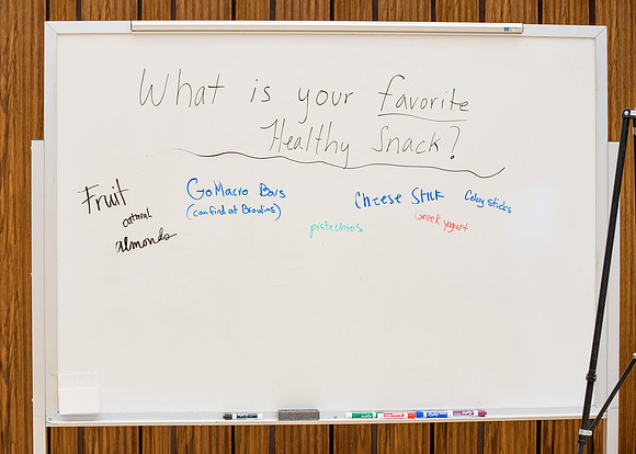 BYU-Idaho Faculty have booths promoting various mental wellness topics. Mix of students and employees mingle among booths.