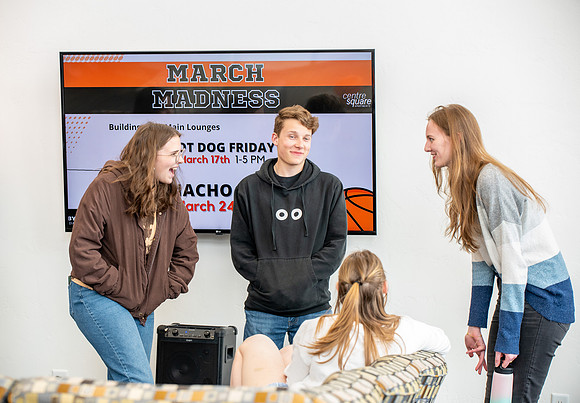 Residents of Centre Square On-Campus housing gather for nachos in anticipation of March Madness.