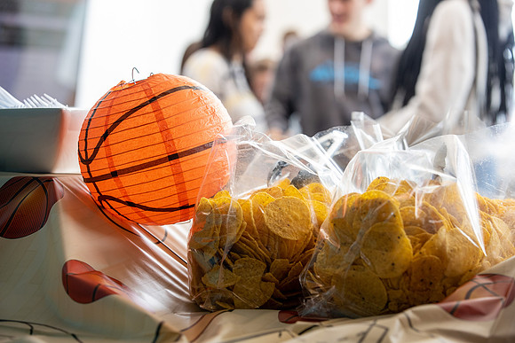 Residents of Centre Square On-Campus housing gather for nachos in anticipation of March Madness.