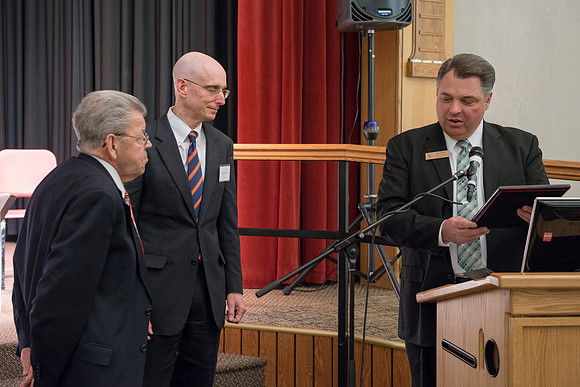 Pres Henry Eyring presents Wilson Brown with  the Eliza R. Snow Award.