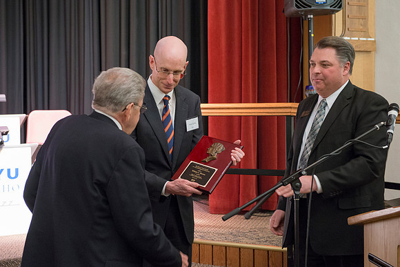 Pres Henry Eyring presents Wilson Brown with  the Eliza R. Snow Award.