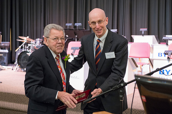 Pres Henry Eyring presents Wilson Brown with  the Eliza R. Snow Award.