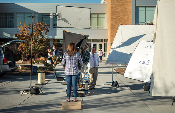 Production of Wagon Box Prophecy. Taylor Ray in front of the Taylor Building.