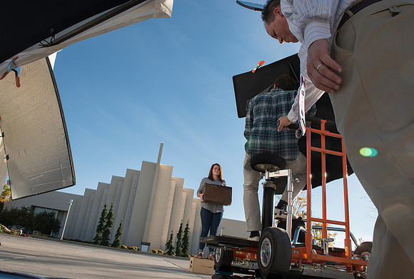 Production of Wagon Box Prophecy. Taylor Ray in front of the Taylor Building.