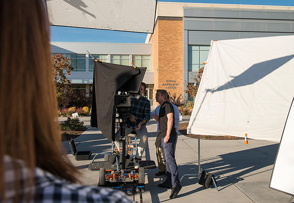 Production of Wagon Box Prophecy. Taylor Ray in front of the Taylor Building.