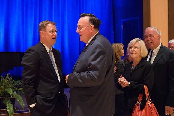 President Gilbert speaks with a friend at the reception.