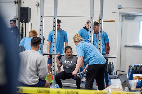 Men and Women compete in three rounds of weightlifting. Squat, Bench, and Deadlift.