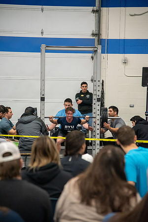 Men and Women compete in three rounds of weightlifting. Squat, Bench, and Deadlift.