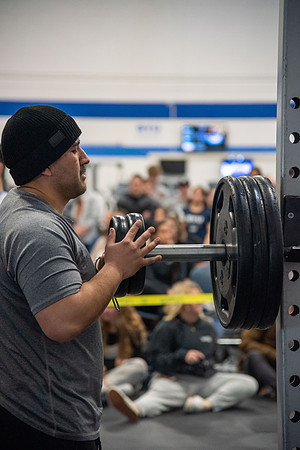 Men and Women compete in three rounds of weightlifting. Squat, Bench, and Deadlift.
