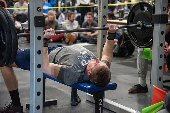 Men and Women compete in three rounds of weightlifting. Squat, Bench, and Deadlift.