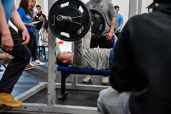 Men and Women compete in three rounds of weightlifting. Squat, Bench, and Deadlift.
