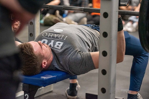 Men and Women compete in three rounds of weightlifting. Squat, Bench, and Deadlift.