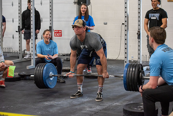 Men and Women compete in three rounds of weightlifting. Squat, Bench, and Deadlift.