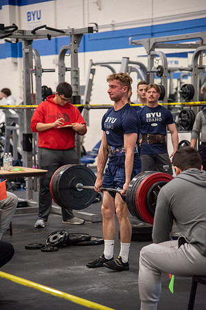 Men and Women compete in three rounds of weightlifting. Squat, Bench, and Deadlift.