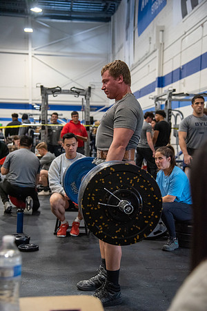 Men and Women compete in three rounds of weightlifting. Squat, Bench, and Deadlift.