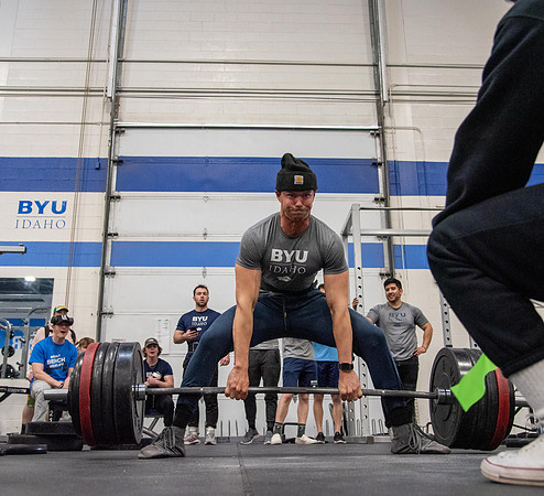 Men and Women compete in three rounds of weightlifting. Squat, Bench, and Deadlift.