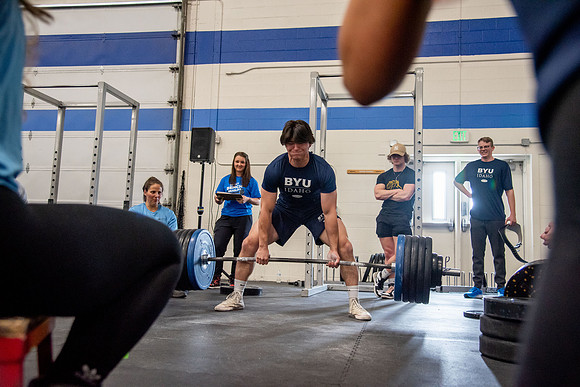 Men and Women compete in three rounds of weightlifting. Squat, Bench, and Deadlift.