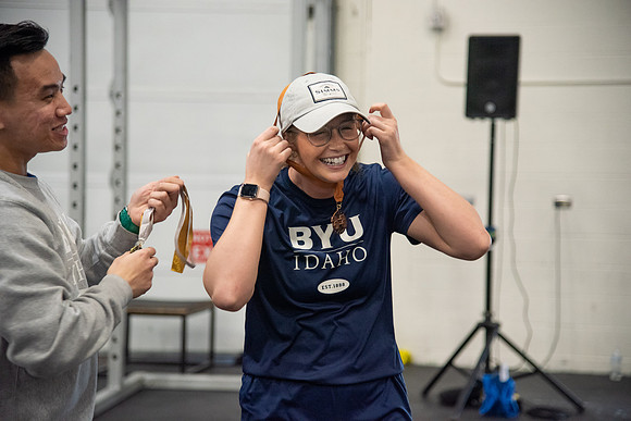 Men and Women compete in three rounds of weightlifting. Squat, Bench, and Deadlift.
