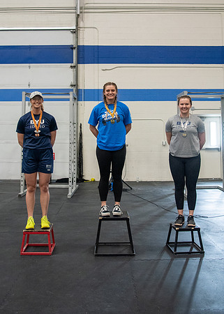 Men and Women compete in three rounds of weightlifting. Squat, Bench, and Deadlift.