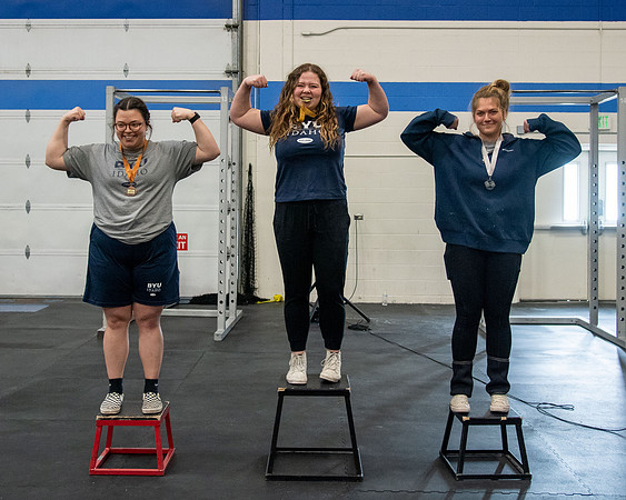 Men and Women compete in three rounds of weightlifting. Squat, Bench, and Deadlift.