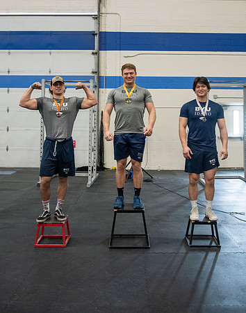 Men and Women compete in three rounds of weightlifting. Squat, Bench, and Deadlift.