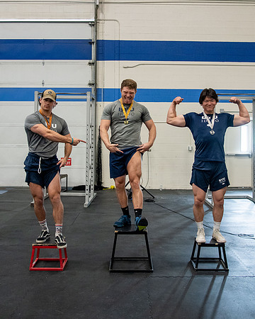 Men and Women compete in three rounds of weightlifting. Squat, Bench, and Deadlift.
