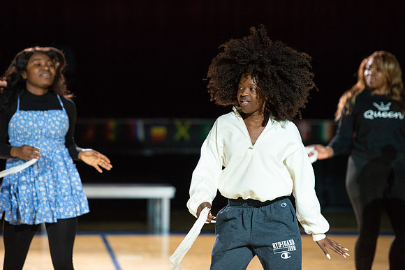 Students rehearse their performance for Cultural Night in the Hart Gym.