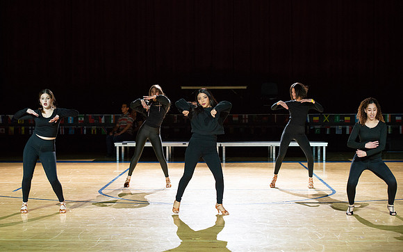 Students rehearse their performance for Cultural Night in the Hart Gym.