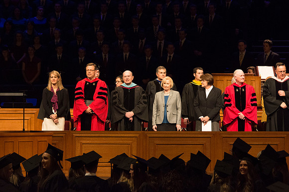 President Clark G. Gilbert, Elder Quentin L. Cook and Elder Kim B. Clark walking out in the graduation processional